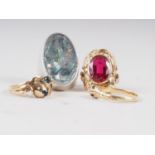 A white metal ring, set oval abalone shell, a yellow metal ring, stamped 585, set synthetic red