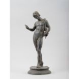 A grand tour patinated bronze figure of Narcissus, 11 1/4" high, on circular base