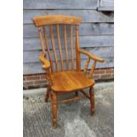 A modern oak Windsor lath back elbow chair