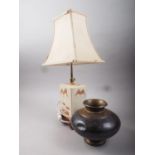 A Chinese porcelain landscape decorated table lamp and an Indian copper and brass water pot