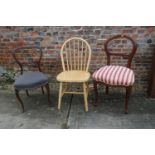 A rosewood loop back dining chair, a mahogany loop back dining chair and a modern spindle back chair