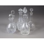 A ship's cut glass decanter, four other decanters and a cut glass water jug