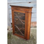 An Edwardian mahogany and line inlaid corner hanging cabinet enclosed astragal moulded glazed