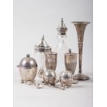 A pair of silver pepper pots with fluted columns, on square base, another pair of egg-shaped