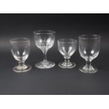 A 19th century cut glass goblet, 6 1/4" high, and three plain glass goblets