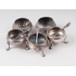 A pair of silver salt cellars, another similar, two white metal salt cellars and three silver salt