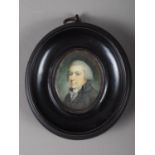 A mid 18th century portrait of a gentleman, inscribed verso Dr Cartwright, 4cm x 3.2cm, in ebony