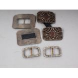 A pair of 18th century cut steel shoe buckles, a pair of paste set shoe buckles and one other pair
