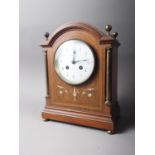 An Edwardian walnut, brass and copper inlaid mantel clock, 10 1/2" high