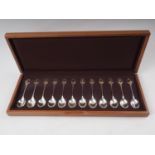 A set of twelve silver and parcel gilt RSPB spoons, in fitted walnut case, 9.6oz troy approx