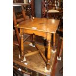 An oak square top occasional table, on turned and stretchered supports, 16" square x 20" high, and