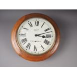 A Smiths oak cased wall clock with painted dial, key and pendulum, 16" dia overall