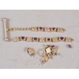 A 9ct gold bracelet set red stones (damaged), 10g