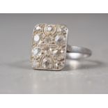 An Art Deco platinum and twelve-stone pave set diamond dress ring, 5.4g