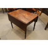 A 19th century mahogany Pembroke table, fitted one drawer, on turned and castored supports, 33" x 44