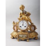 An 19th century French gilt brass mantel clock with putto surmount and flanking porcelain panels, 12