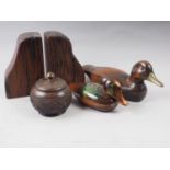 A pair of hardwood bookends, a hardwood jar and cover, and two carved wood model ducks