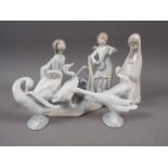 A Lladro figure of a girl kissing, 7" high, a Madonna and child, 7 1/4, a Lladro figure group of