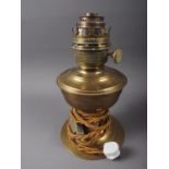 A Veritas Superspeed brass oil lamp, 12" high overall, now converted to electricity