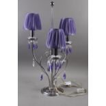 A contemporary three-light table lamp with clear and purple glass spear drops