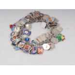 A silver and enamelled souvenir charm bracelet