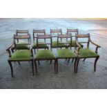 A set of ten mahogany rope twist bar back dining chairs with drop-in seats, on sabre supports (8+2)