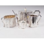 A late 19th century Walker & Hall silver plated and engraved three-piece teaset, and a similar sugar