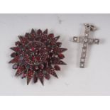 An early 20th century Austro-Hungarian star burst brooch, set facetted garnets, mount unmarked, 44mm