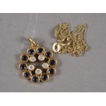 An 18ct gold diamond and sapphire pendant, 5g, on a 14ct gold fine link necklace, 1.9g