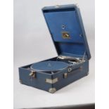 An early 20th century HMV portable record player, in blue case