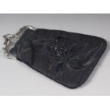 A silk and sequin work evening bag with silver frame and chain