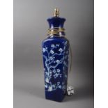 A Chinese blue and white table lamp, decorated prunus, 20" high