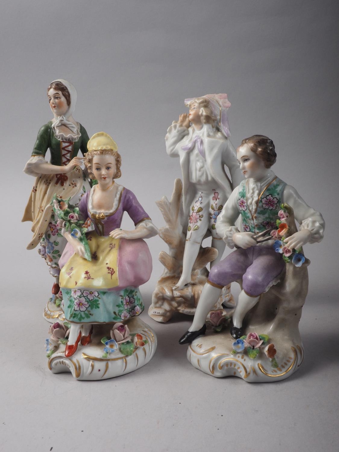 A pair of Sitzendorf porcelain figures, gardeners, 4 1/4" high, a Sitzendorf shepherdess, 6 1/2"