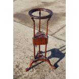 A mahogany basin stand of Georgian design, fitted two drawers, on tripod splay support and pad feet,