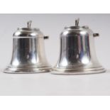 A pair of silver bell-shaped desk inkwells with hinged lids and liners, 2 1/4" high