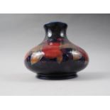 A Moorcroft pomegranate bulbous vase, 6 1/2" high (crack to rim)