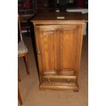 An Ercol side cupboard enclosed one door over one drawer, 22" wide x 19" deep x 38" high