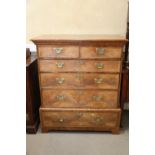 A Georgian figured walnut and feather banded chest on stand, the upper section fitted two small