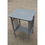 An early 20th century shape top painted two-tier occasional table, on turned supports, 22" wide x