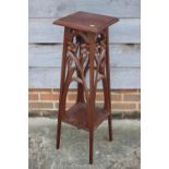 An early 20th century carved mahogany jardiniere stand with floral panels, 11" square x 36" high,