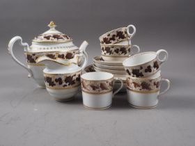 A Worcester Flight & Barr part tea service with bands of sepia grapes and gilt decoration (hair
