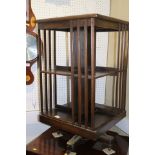 An early 20th century oak revolving bookcase, 18" square x 32" high