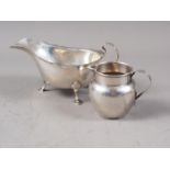 An Irish silver sauce boat, 3.4oz troy approx, and a silver milk jug, 1.9oz troy approx