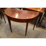 A 19th century mahogany box and ebony strung semicircular side table, on square taper supports,