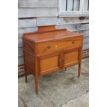 An Edwardian walnut box and ebony strung ledge back sideboard, fitted one long drawer over