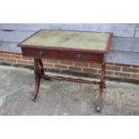 A mahogany writing desk of Georgian design with green tooled leather lined top, fitted two