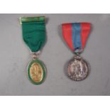 A British Imperial Service Medal, in fitted box, and a commemorative medal