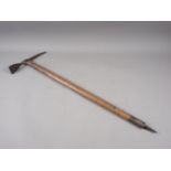 A WWII ice axe, dated 1944, 31 1/2" long