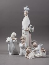 A Lladro figure, "Going to Market", 14" high, and four cherubs