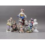 A pair of 19th century Continental figures in period costumes, 5" high, and a shepherdess, 10" high,